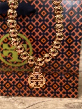 New! Gorgeous beaded, stretchy bracelet with Tory Burch logo charm + gift wrap